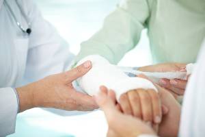 wrapping bandage around forearm