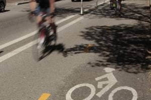 riding bicycle down the street