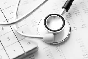 stethoscope on top of billing statement