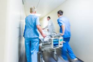 doctors transporting patient down hallway