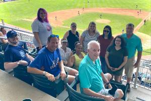 scott cooper and chuck schmidt and staff at baseball game