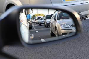 car sideview mirror during daytime