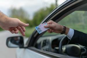 driver handing over license