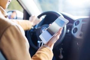 female driver texting and driving