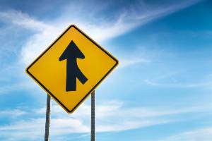 yield sign in front of sky