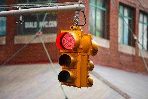 red light at intersection in rain