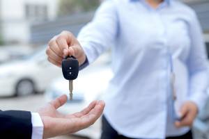 handing key fob to another person