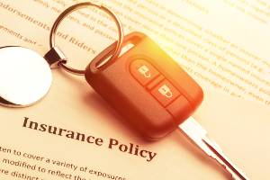key fob sitting on insurance policy