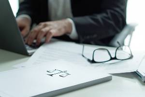 lawyer with legal documents on desk