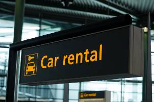 yellow car rental sign