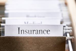 insurance label on folder in drawer