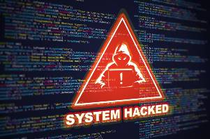 system hacked over screen with code on it
