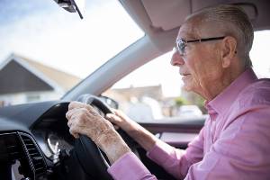 elderly man struggling to drive