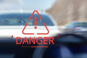blurred image of a car following too closely