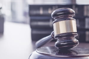 injury claim versus lawsuit - picture of legal gavel