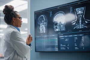 stock image of doctor examining brain mri