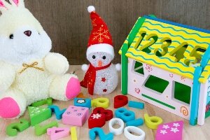 photo illustration of a toy snowman and other children's toys