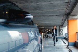 businesswoman walking toward her car