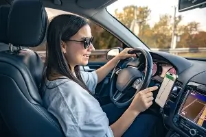 A driver using a phone gps.