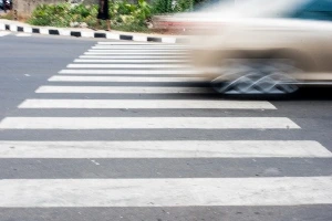 car speeding through crosswalk