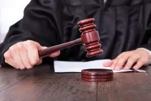 image of judge striking gavel on bench