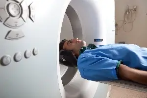 Young man about to enter MRI maching