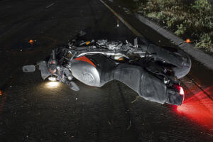 motorcycle on pavement after crash