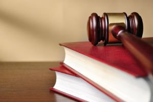 legal books with gavel on top