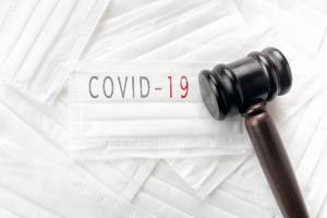 mask that says covid-19 with gavel on top