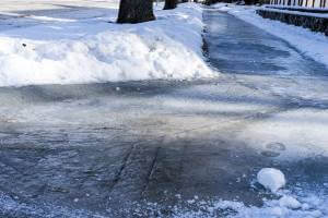 snow and ice on sidewalk during daytime