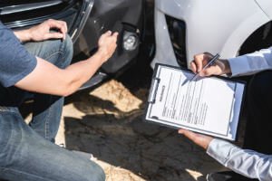 filling out insurance forms after car crash