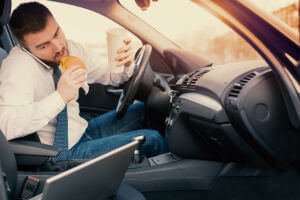 man distracted while driving
