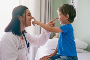 female doctor with boy patient
