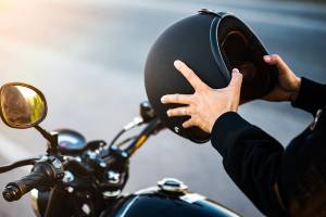 bike rider about to put on helmet