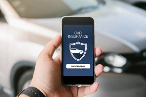 reviewing auto insurance on cellphone