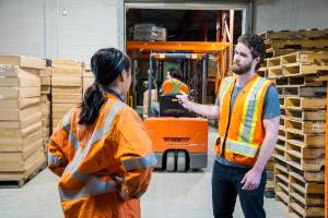 argument in warehouse behind forklift
